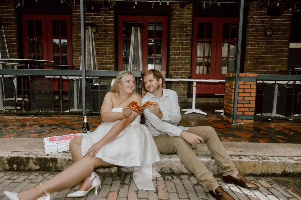 Couple enjoying pizza during their engagement session in Florida