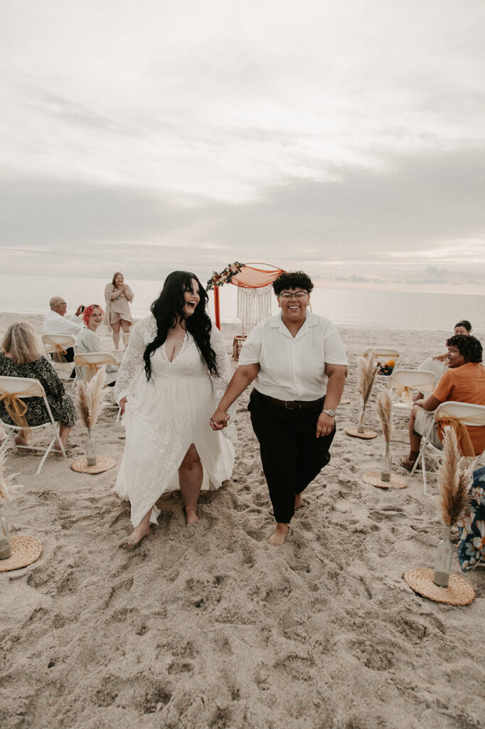 Leah and Olivia joyfully laughing after their elopement ceremony