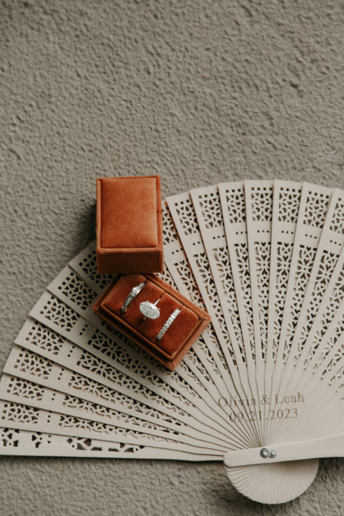 Terracotta ring box holding bridal wedding rings