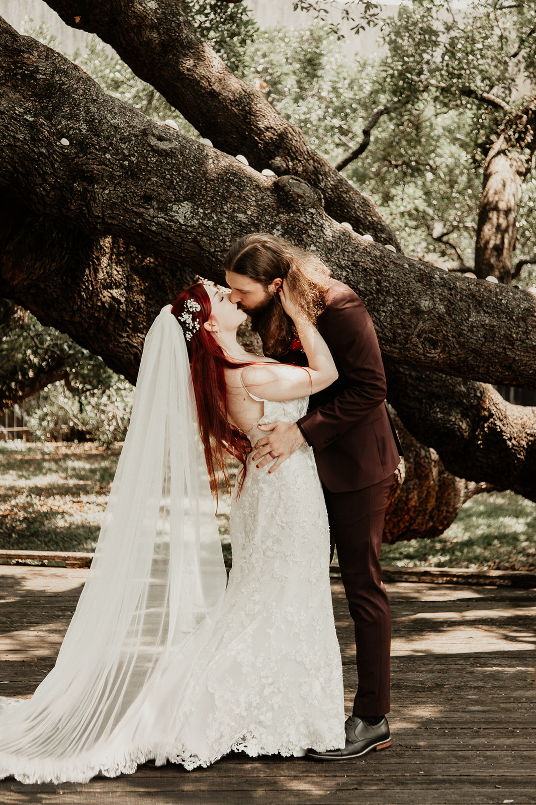 Bride and groom sharing a short kiss after their ceremony