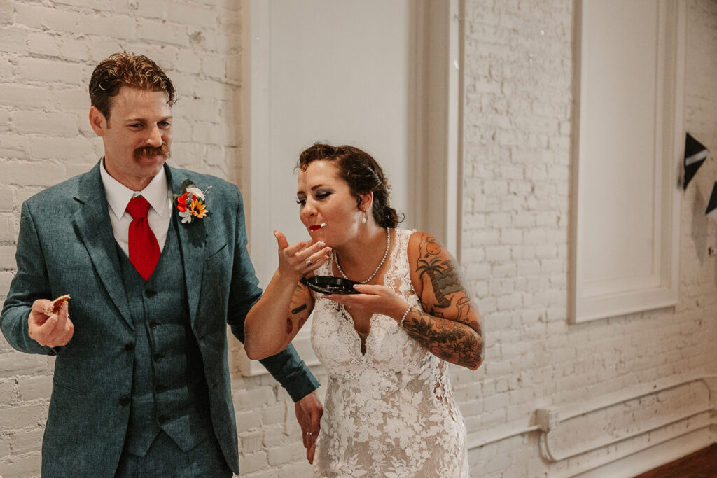 Jennah and Ross enjoying their cake during their reception