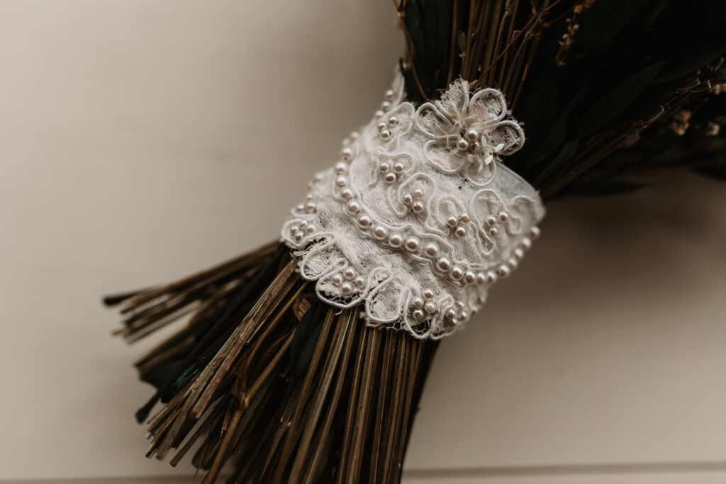 Lace wrapped around bridal bouquet