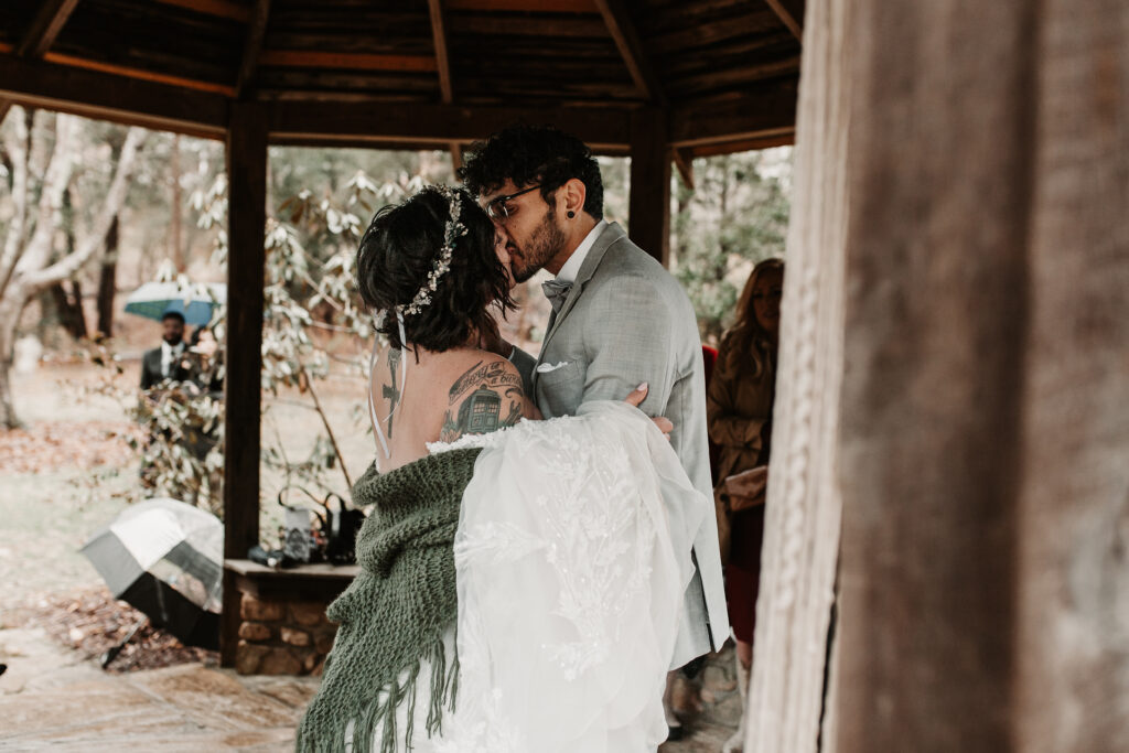 Danielle and Jon's first dance under the gazebo at the Asheville botanical gardens