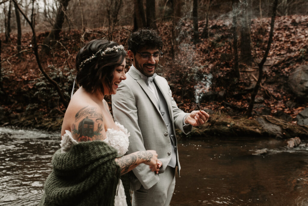 Bride and Groom celebrating their elopement by the river in Asheville North Carolina