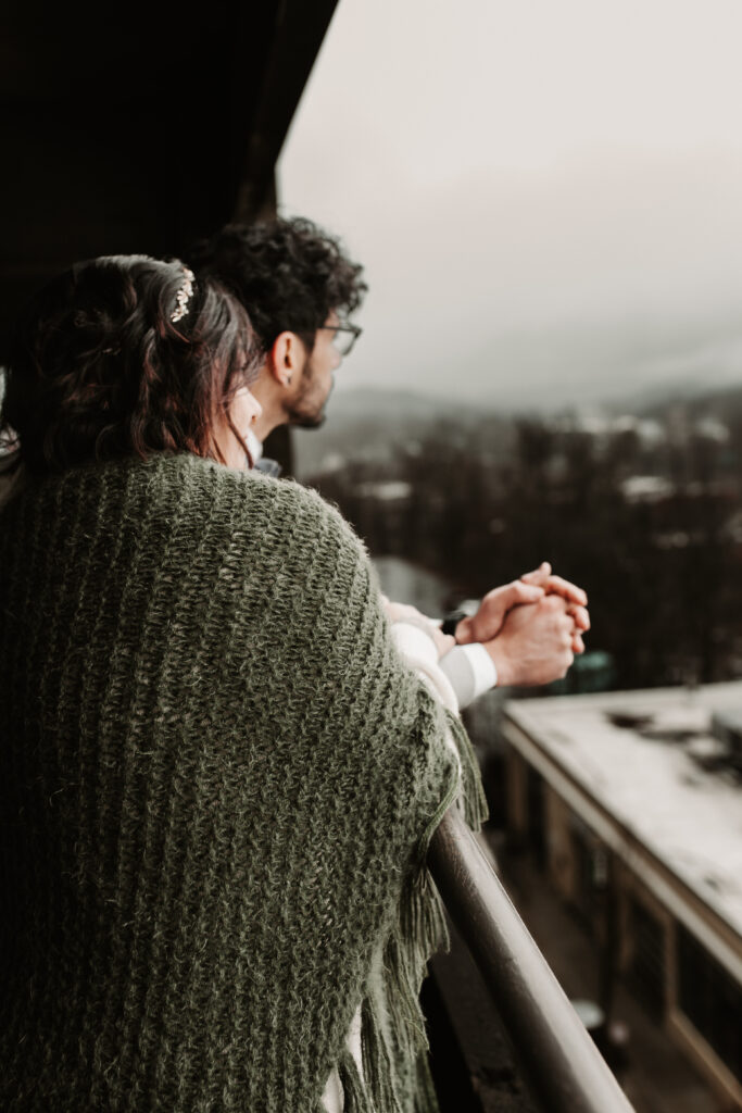 Danielle and Jon looking at the mountains on a rainy day in Asheville 