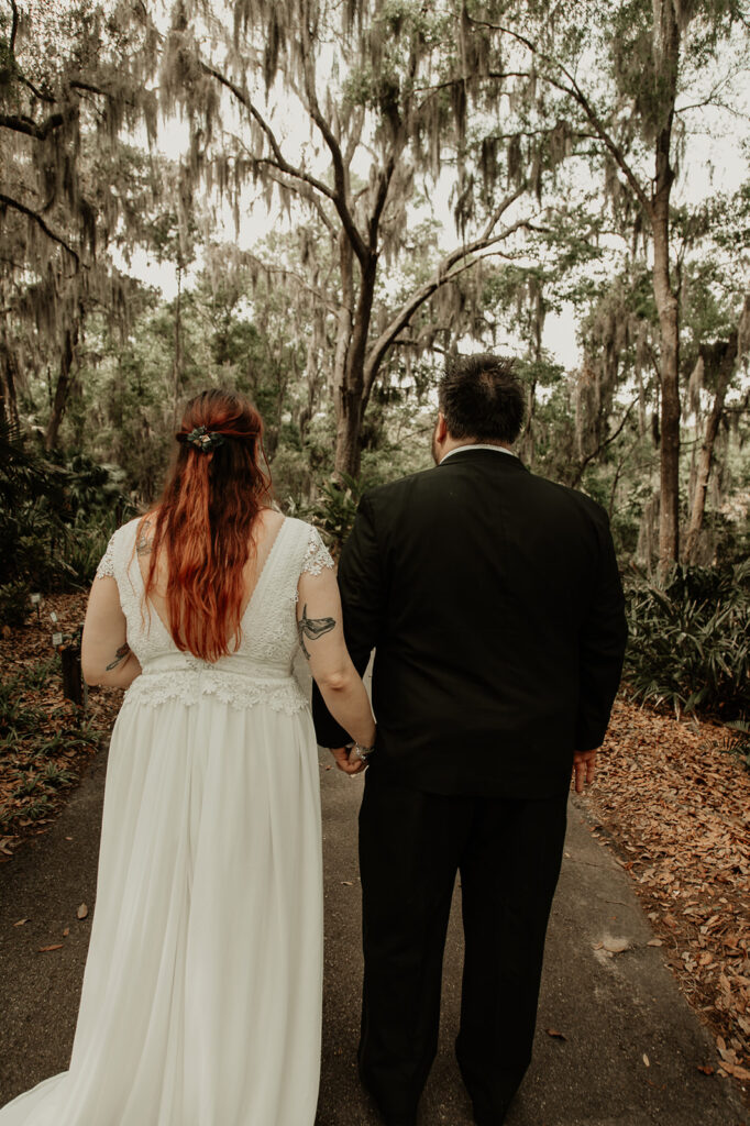 bride and groom walking away