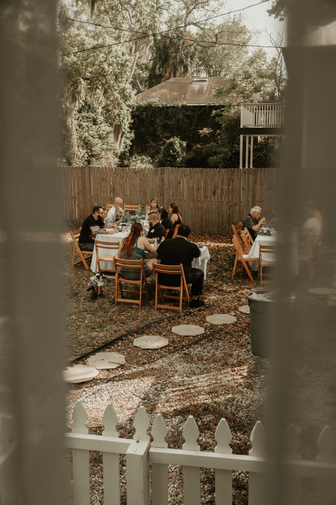 guests enjoying dinner outside during the reception