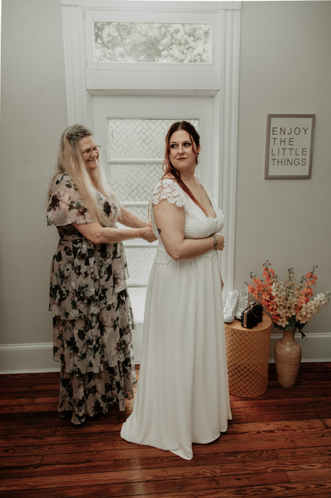 Alicia and her mom getting ready at their Florida airbnb on her elopement day