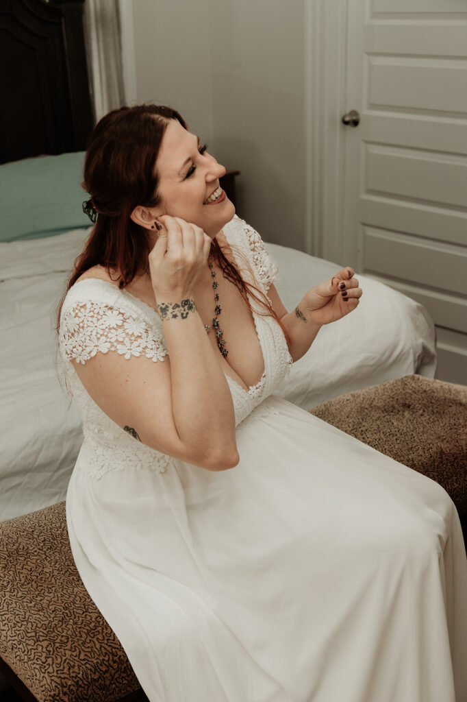 Bride putting on her earring on her elopement day in florida 