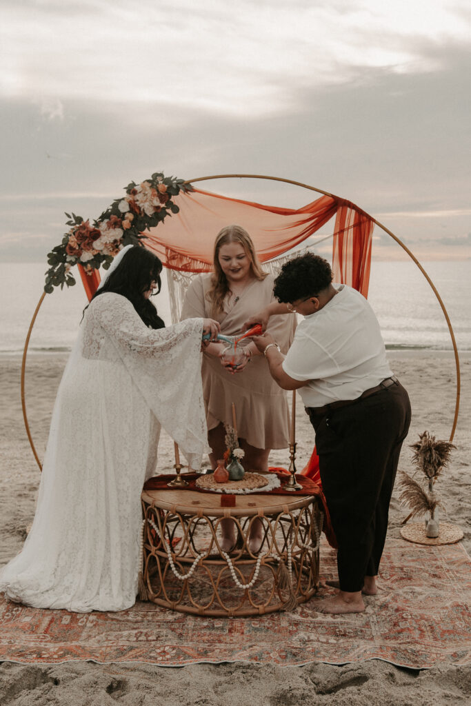 Leah and Olivia's Sand pouring ceremony during their Florida beach elopement