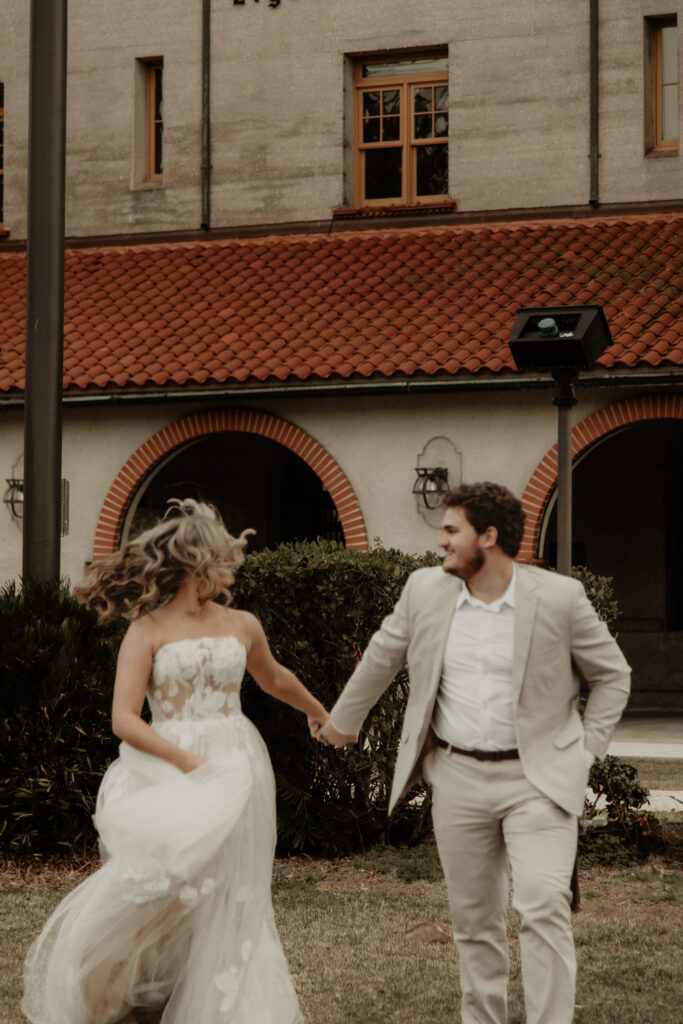 Artistic Running portrait of bride and groom at the Lightner Museum in St, Augustine Fl