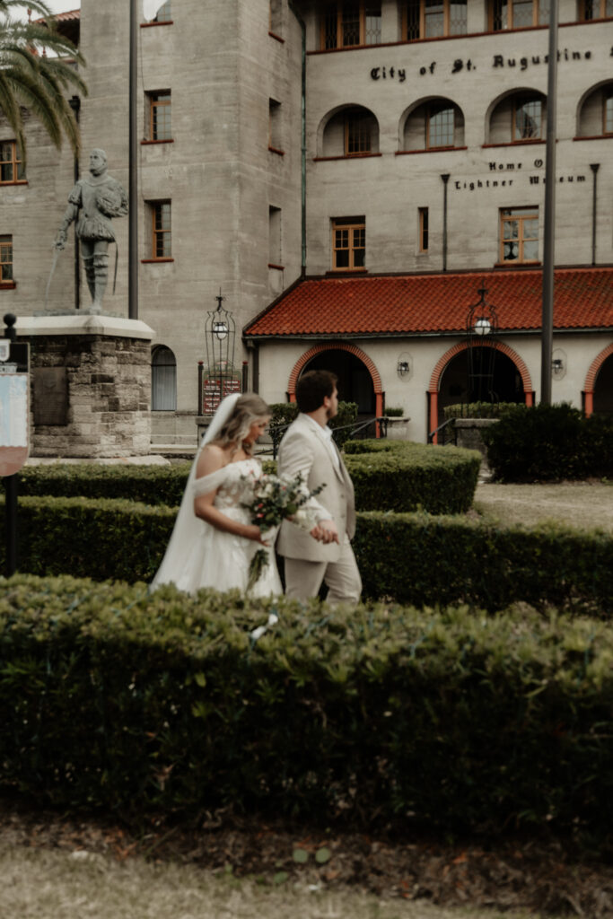 artistic photos of bride and groom in front of the lightner museum