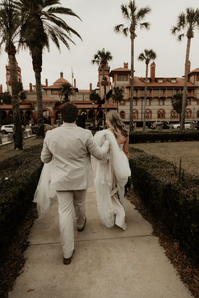 Bride and groom walking down the street