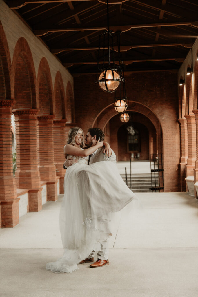 Groom lifting Bride