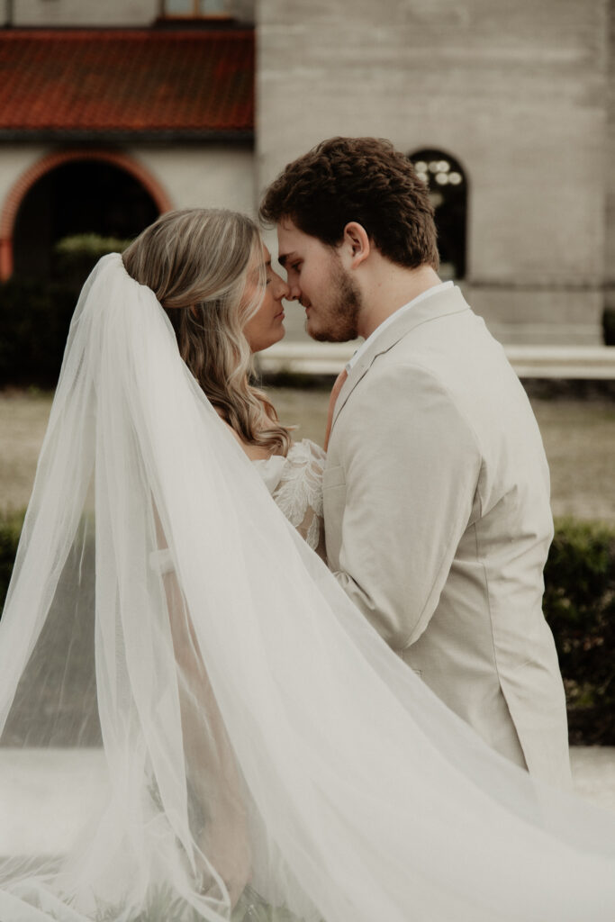 bride and groom are nose to nose for a beautiful couples portrait.