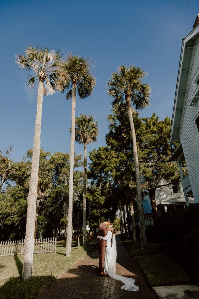 Couple kissing on cobble stone streets in St. Augustine Florida during their elopement