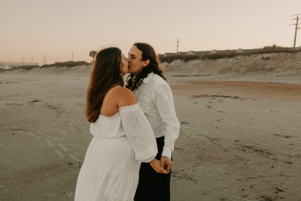 Marissa and Jeff kiss on the Vilano Beach during their elopement