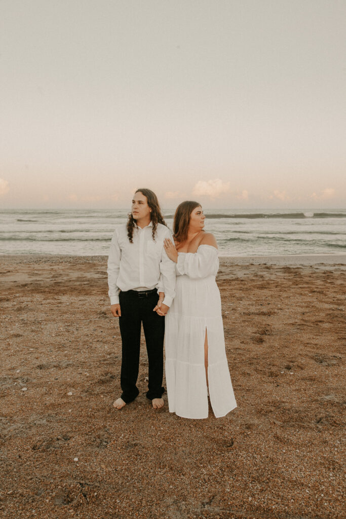 Bride and groom looking in opposite directions during Vilano Beach elopement 