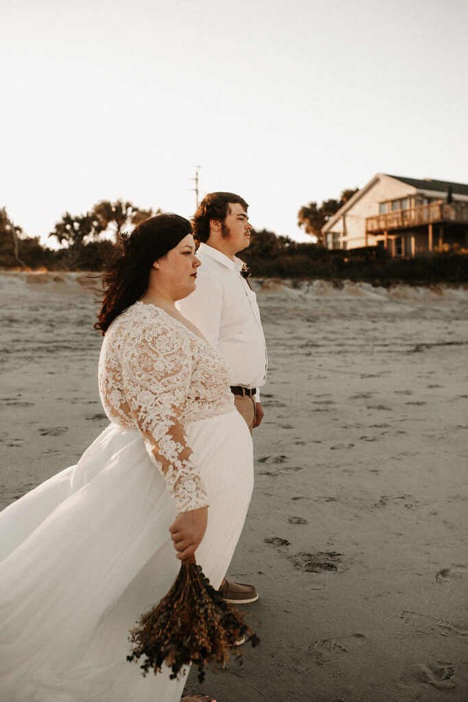 Artistic Bride and groom Portrait on the beach during golden hour